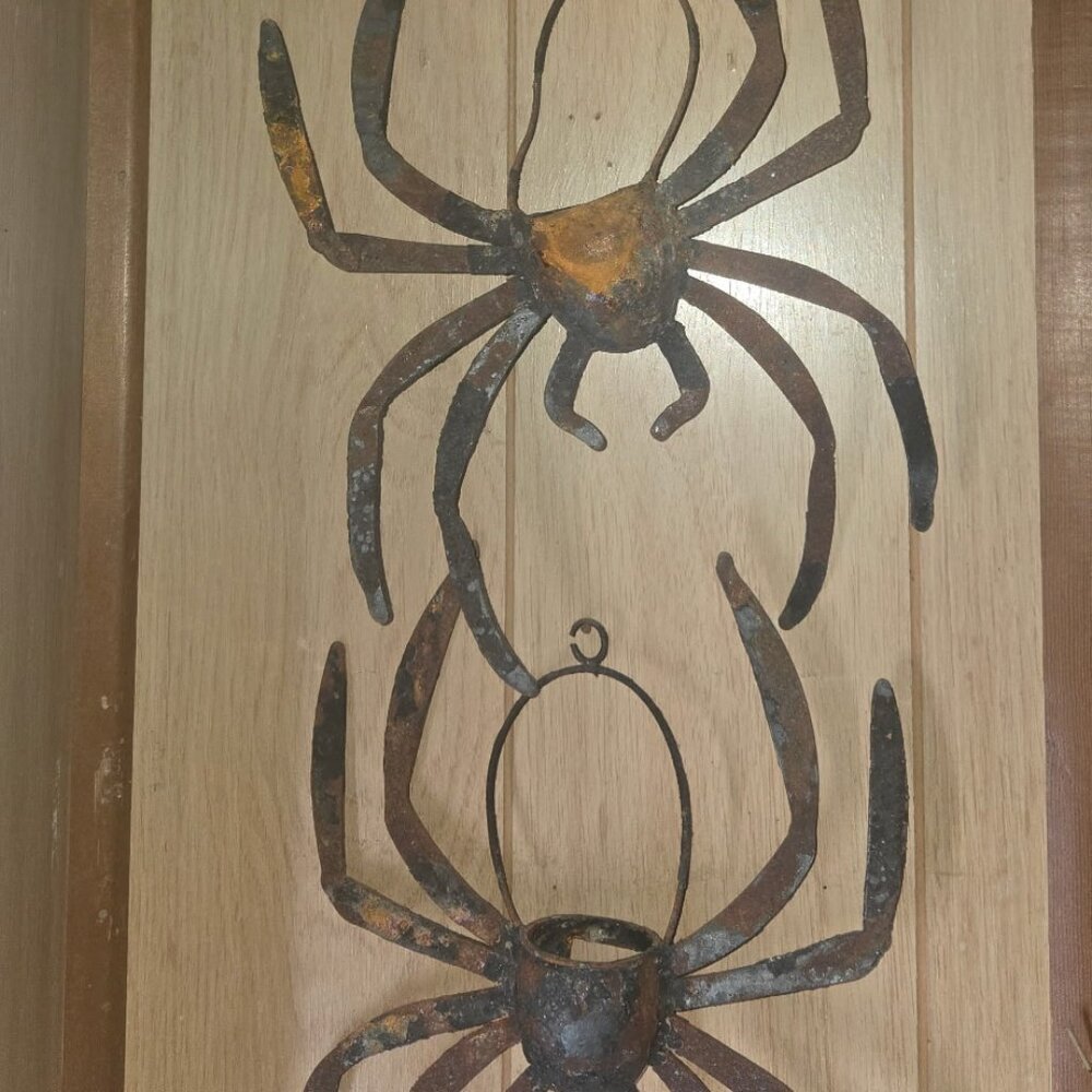 Wrought iron spider candle holders.